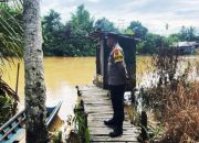 Polsek Kintap patroli pantau debit air cegah banjir akibat hujan deras